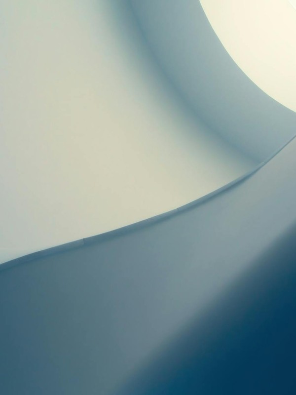 Sophisticated minimalist abstract with smooth blue curves and geometric design, perfect for a modern background.